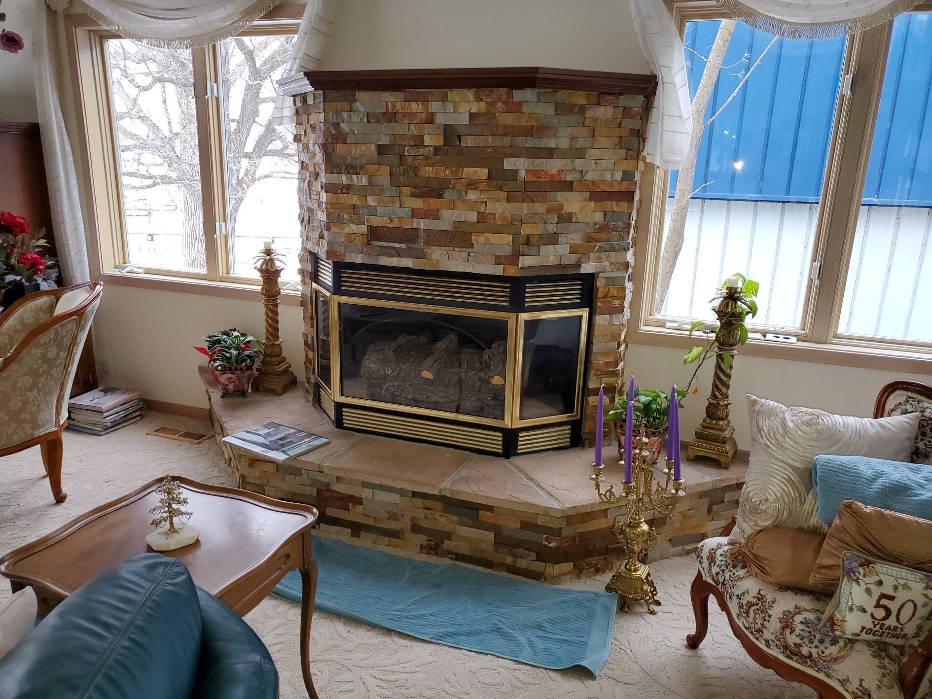 Fireplace surround and hearth with drystack tile pattern in mixed earth tones.
