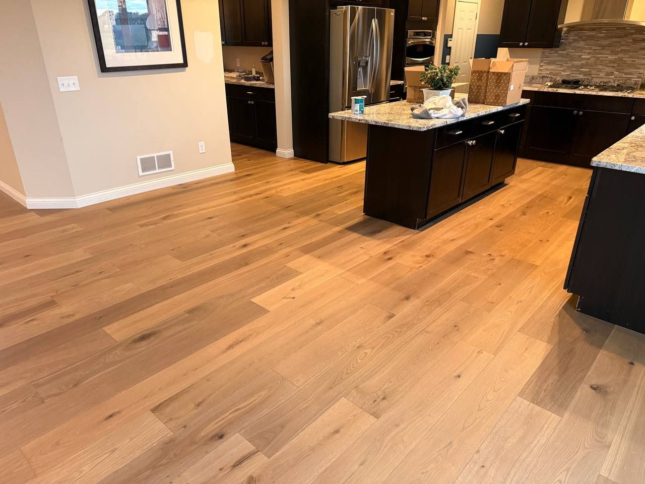 Engineered hardwood kitchen floor installed by Anton's Floorcovering in Apple Valley, MN